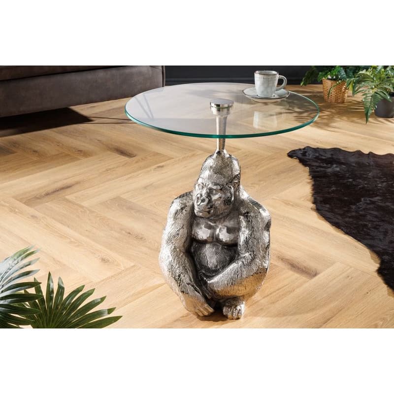 Estila Luxusný glamour okrúhly príručný stolík Tierra Glam s podstavou v tvare gorily a so sklenenou vrchnou doskou strieborná 51 cm
