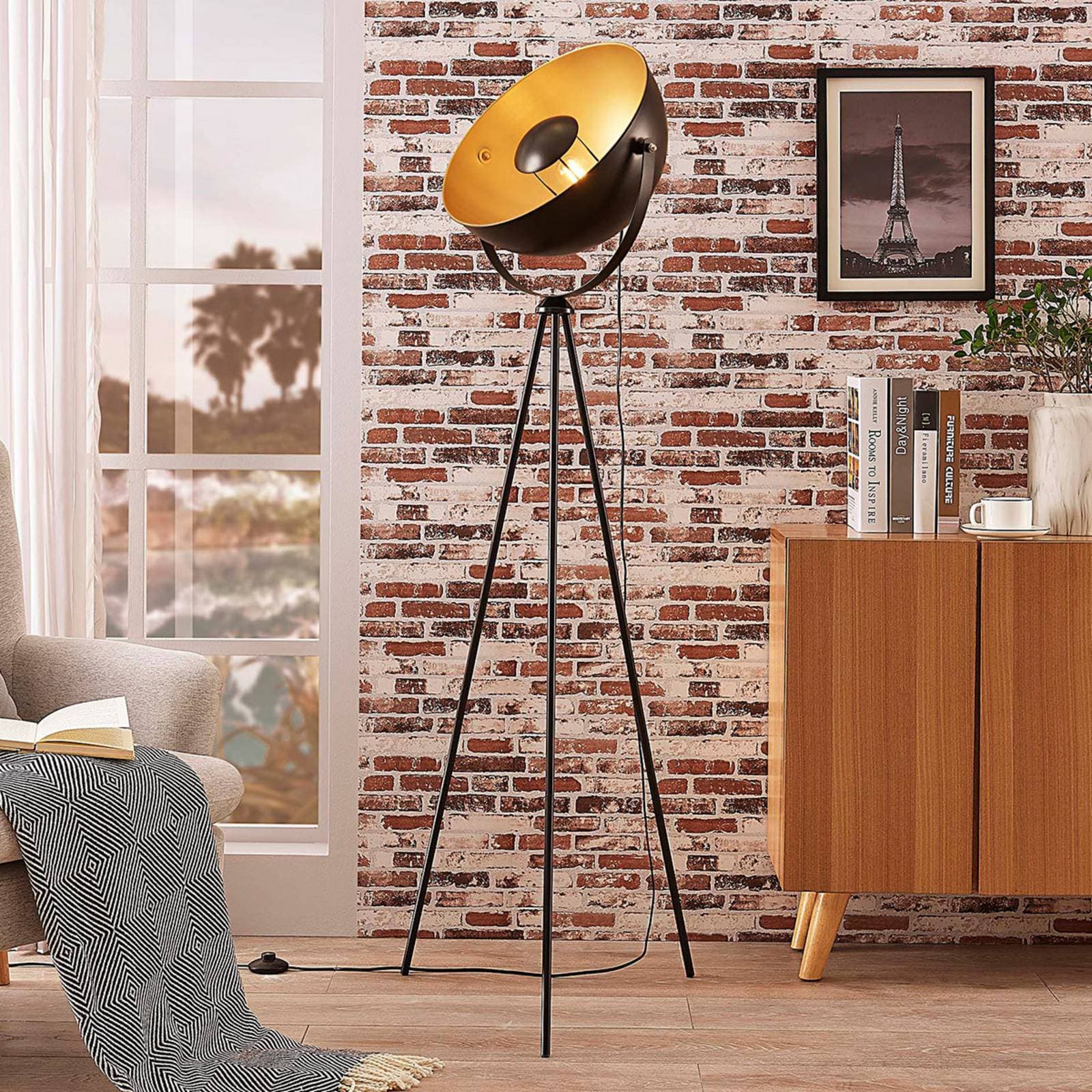 Stojacia lampa Lindby Meline, čierna/zlatá, kov, trojnožka